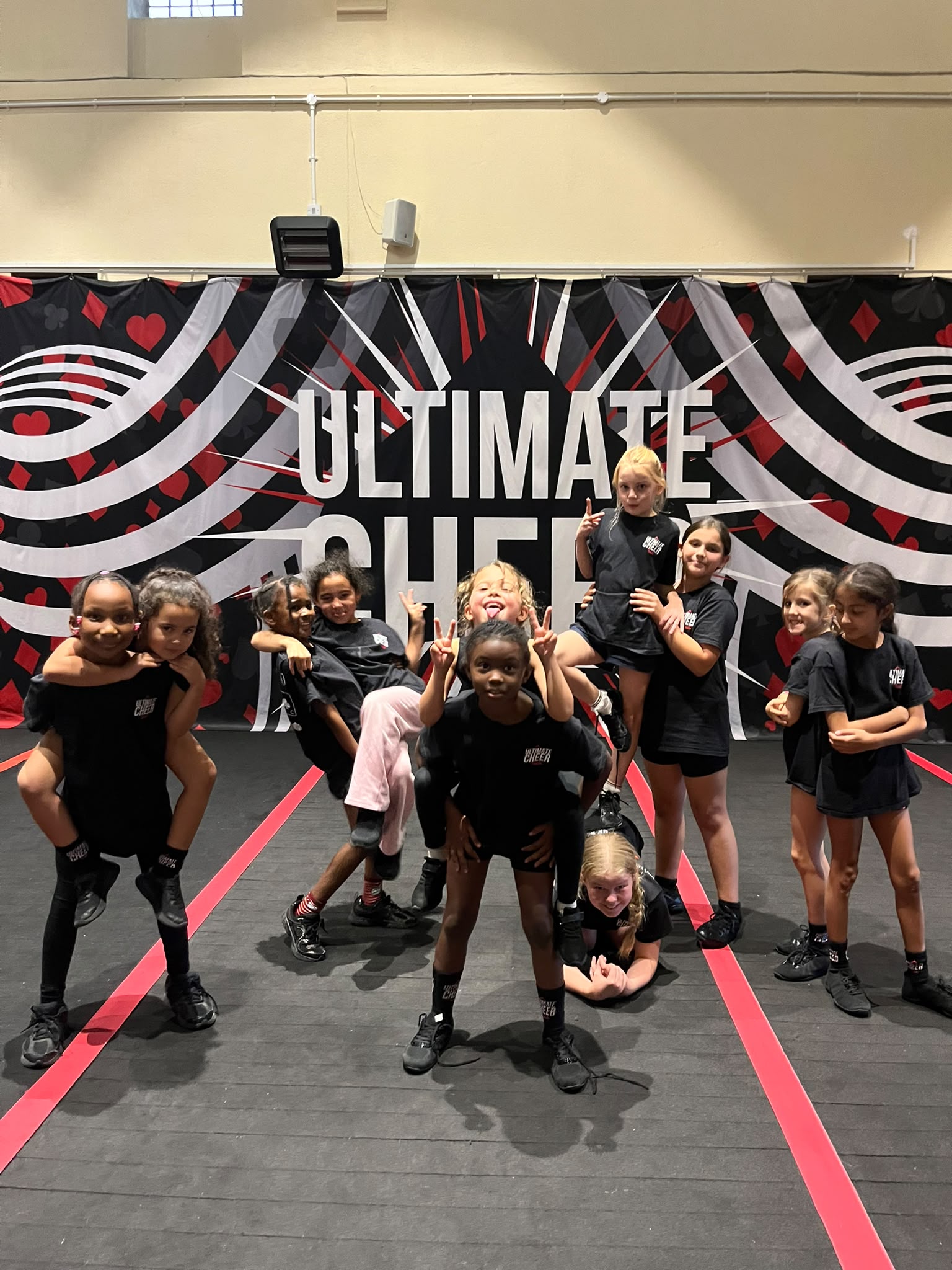 Children practising cheer together at an Ultimate Cheer holiday camp